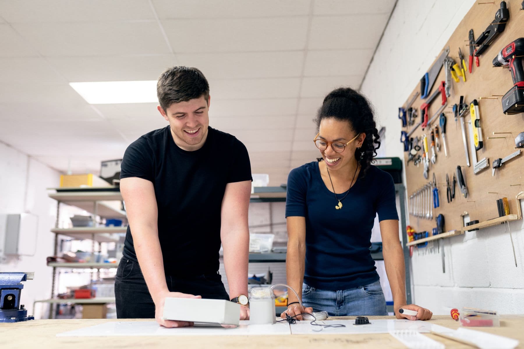 Engineers discussing a prototype in a workshop